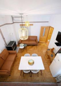 a living room with a couch and a table at Villa Jakov in Podgorica