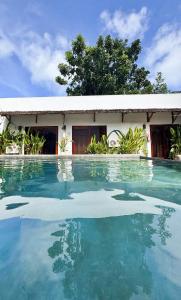 a swimming pool in front of a house at Casa de loren- generator and starlink in General Luna