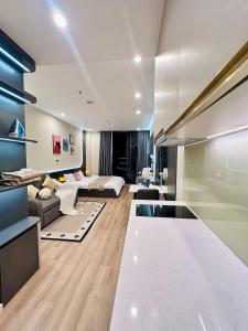 a large living room with a couch and a table at ICON40 Homestay Hạ Long - Ocean View in Ha Long
