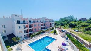 a view of a swimming pool in front of a building at Seaside Escape Studio in Byala