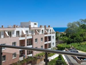 a view of a building with the ocean in the background at Seaside Escape Studio in Byala