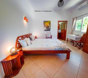 a bedroom with a large bed in a room at Le Lagon Bleu in Antsatrakolo +63 photos