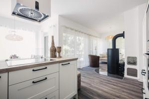 a kitchen with a sink and a stove at Sommersonne in Zingst