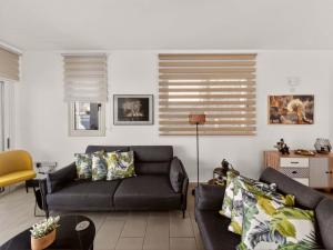 a living room with a couch and a table at Villa Allegra in Protaras