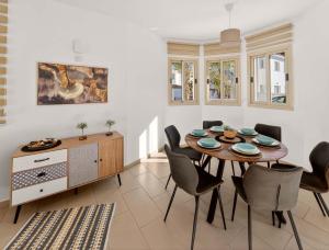 a dining room with a table and chairs at Villa Allegra in Protaras +13 photos