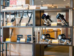 a display shelf with many different devices on it at Yatsushiro Grand Hotel in Yatsushiro +22 photos