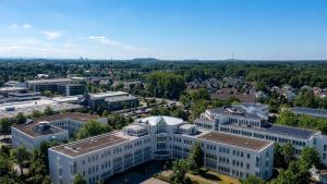 an aerial view of a building in a city at Oskar25 Aparthotel in Ismaning