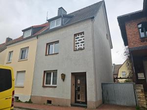 a gray house with a black roof at Pension Highway - Osnabrück Klarastr 11 in Osnabrück