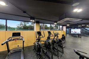 a gym with a bunch of exercise bikes in it at Sunshine Beach Layan by Beringela in Layan Beach