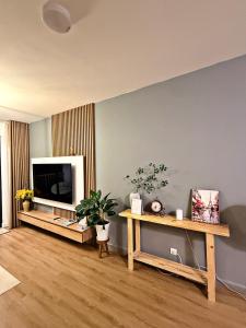 a living room with a flat screen tv on a wall at Căn Hộ Biên Hoà in Bien Hoa