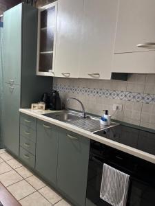 a kitchen with a sink and a counter top at MiLù Sicily House in Modica