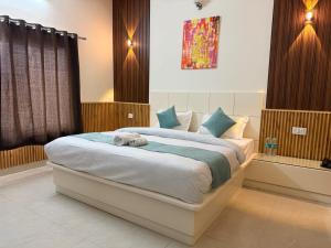 a bedroom with a bed with a stuffed animal on it at Mandola Stays in Chamoli