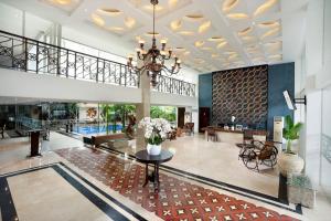 a lobby of a hotel with a pool at 1O1 URBAN Heritage Yogyakarta Lynn Prawirotaman in Yogyakarta