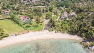an aerial view of the house and the beach at Hacienda Beachfront Villa, Spathies in Nikiti