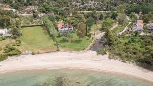 an aerial view of a house on the beach at Hacienda Beachfront Villa, Spathies in Nikiti