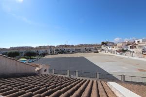 an empty parking lot with buildings in the background at Torrevieja Spectacular Townhouse in Torrevieja