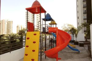 a playground with a slide at Palm Suite With Sky Terrace Penthouse 11th Floor in Rajkot