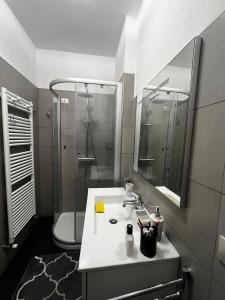 a bathroom with a sink and a toilet and a mirror at Casa di Azzurra in Capolona +12 photos