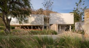 a modern house with a white facade at Number Three Pool Villa Khaoyai in Ban Tha Maprang
