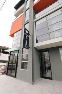 a building with a sign on the side of it at STAR Hotel in Bathore