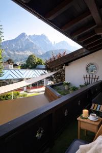 a balcony with a view of the mountains at Toms ONE in Saalfelden am Steinernen Meer