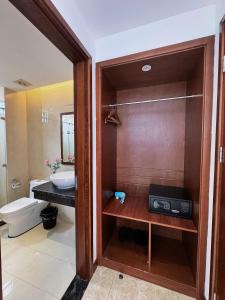 a bathroom with a toilet and a sink at Ruby hotel Tuần Châu in Ha Long +36 photos