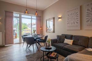 a living room with a couch and a table at Rodehuus Wohnung 1 in Borkum