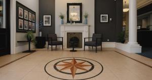 a lobby with chairs and a star on the floor at The Caledonian New Southlands Hotel in Scarborough