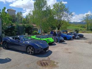 a row of cars parked in a parking lot at Hôtel Restaurant L'Orée du Vercors in Montmaur-en-Diois