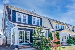 a blue house with white trim at Orange Queen LLC in East Orange