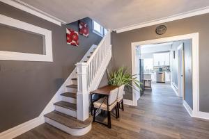 a staircase in a home with a table and chairs at Orange Queen LLC in East Orange +12 photos