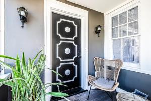 a chair sitting in front of a door at Orange Queen LLC in East Orange