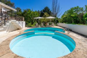 a swimming pool in the backyard of a house at Bon Jardi in Esporlas