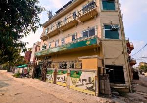 a building on the side of a street at Golden One Hotel in Lahore