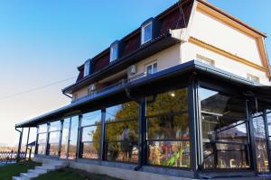 a building with a lot of windows at Kapija Grada in Ečka +11 photos