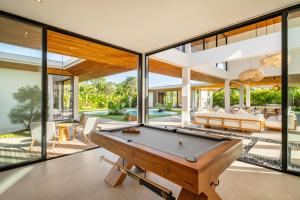 a pool table in the living room of a house at Uluwatu Zen Villas in Badung