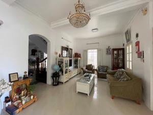 a living room with a couch and a table at Maison Vy Homestay in Hue
