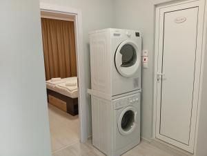 a washing machine and a dryer in a room at P51 Central - Modern 2 Bedroom Apartment in Stara Zagora
