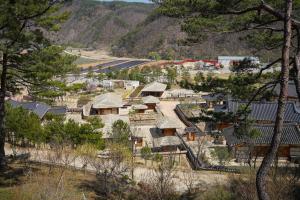 an aerial view of a village with houses and trees at 청송 한옥호텔 안 in Imjŏn-dong