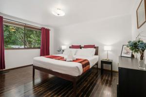 a bedroom with a large bed and a window at Lady Marmalade in Blackheath