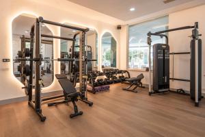 a gym with a lot of treadmills and machines at Adalya Bliss in Side