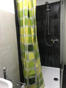 a shower curtain in a bathroom with a sink at Easy Stay Monteurswohnung in Geislingen an der Steige +8 photos