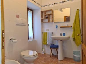 a bathroom with a toilet and a sink at Agriturismo PEDROSOLA in Brisighella +70 photos