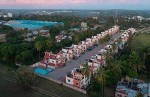 an aerial view of a resort with palm trees and buildings at Greenwood Apartments in Mtwapa