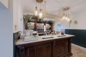 a bar with a counter in a room at Florence Suite Boutique Hotel and Restaurant in Portsmouth