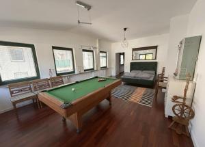 a living room with a pool table and a couch at Cityscape Loft Hannover - 216qm 15 Personen in Hannover +15 photos