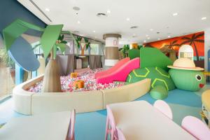 a childrens play area with a playground at Marriott's Phuket Beach Club in Mai Khao Beach