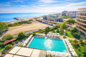 an aerial view of a swimming pool and a beach at Grand Hotel Pomorie - Medical spa in Pomorie