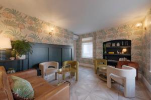a living room with a couch and chairs at Somerset House Boutique Hotel and Restaurant in Portsmouth