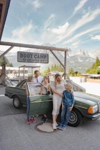 a group of people standing in the back of a car at Tirol Lodge in Ellmau